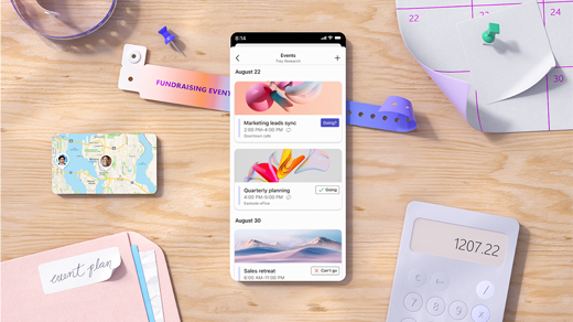 Team UI on mobile phone, sitting on desk with blue and pink ui shapes.